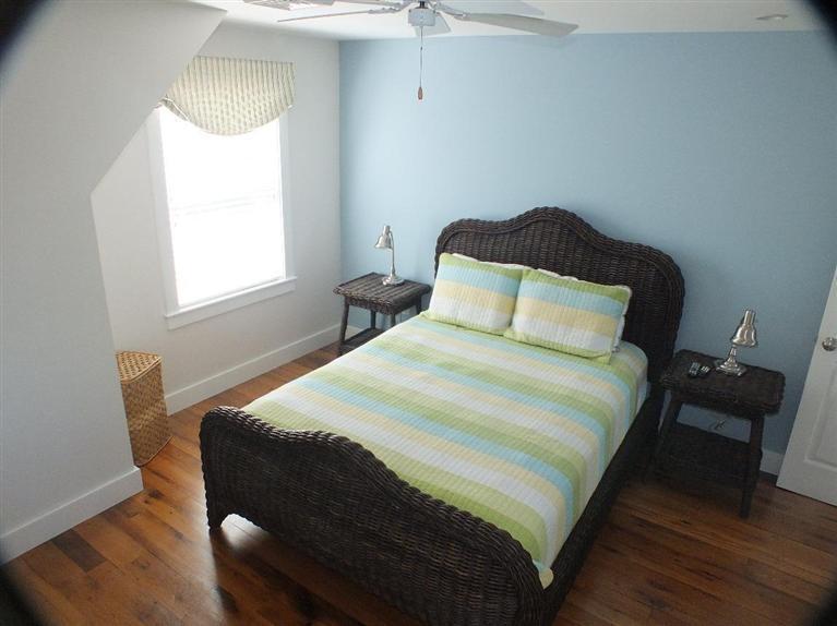 116 Castle Road Truro, MA 02666 - Photo 17 of 27 a bedroom with a bed and window