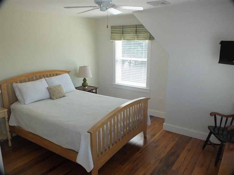116 Castle Road Truro, MA 02666 - Photo 18 of 27 a bedroom with a bed and a window