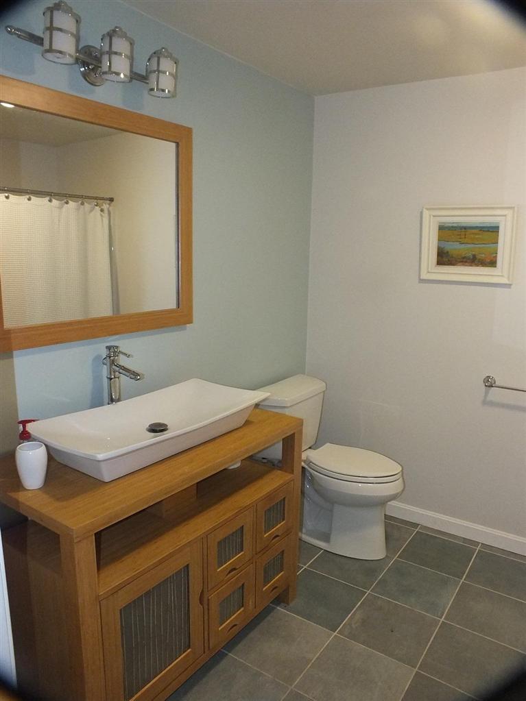 116 Castle Road Truro, MA 02666 - Photo 21 of 27 a bathroom with a sink toilet and mirror
