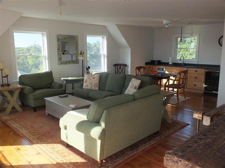 116 Castle Road Truro, MA 02666 - Photo 22 of 27 a living room with furniture and a large window