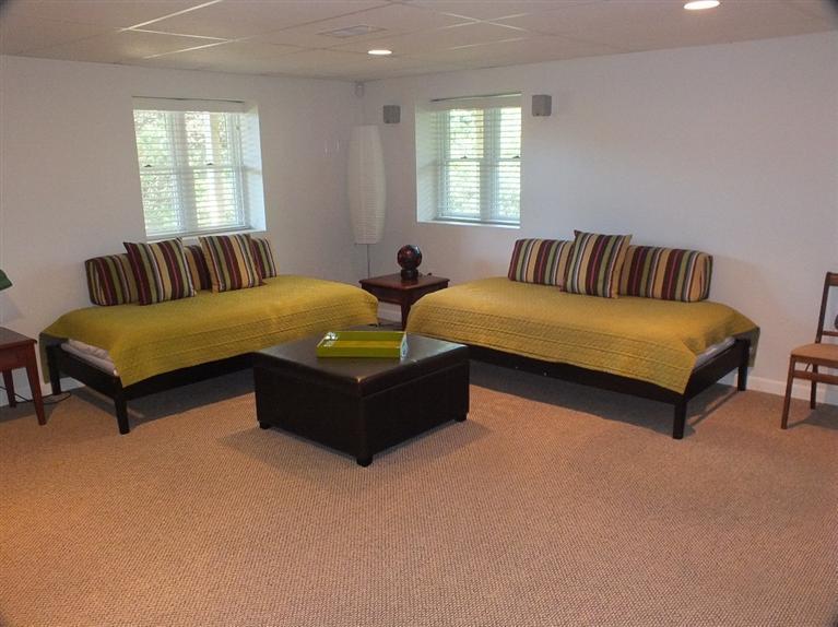 116 Castle Road Truro, MA 02666 - Photo 23 of 27 a living room with couches and large window