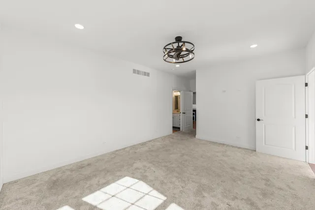 an empty room with a white walls