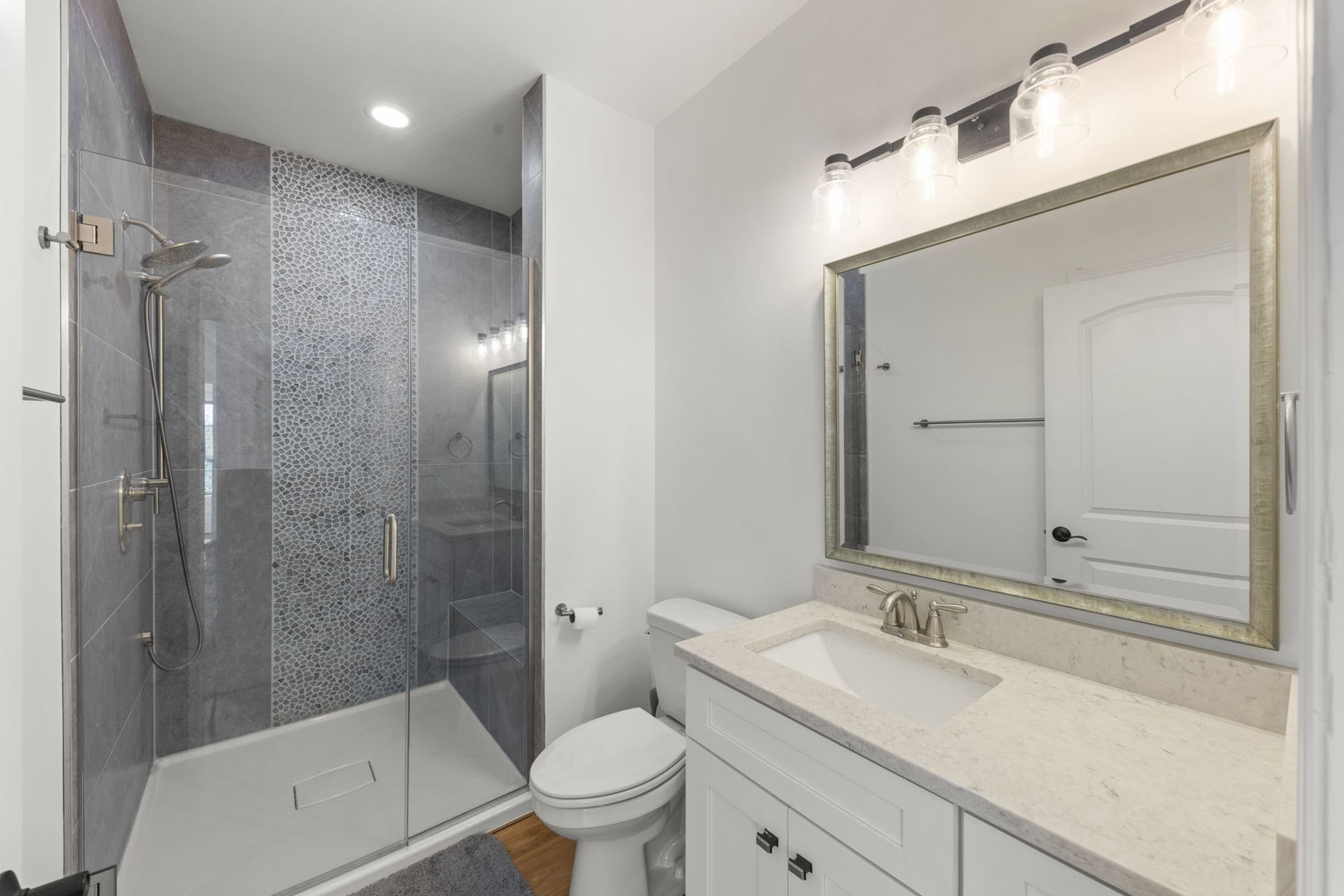 26411 West Stephanie Drive Channahon, IL 60410 - Photo 14 of 28 a bathroom with a sink a toilet and shower