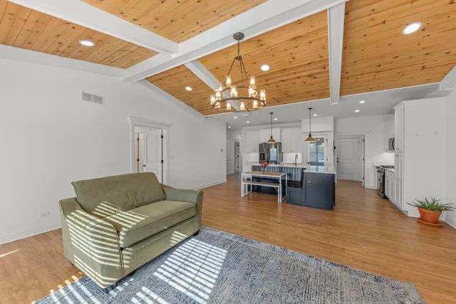 a living room with furniture and a rug