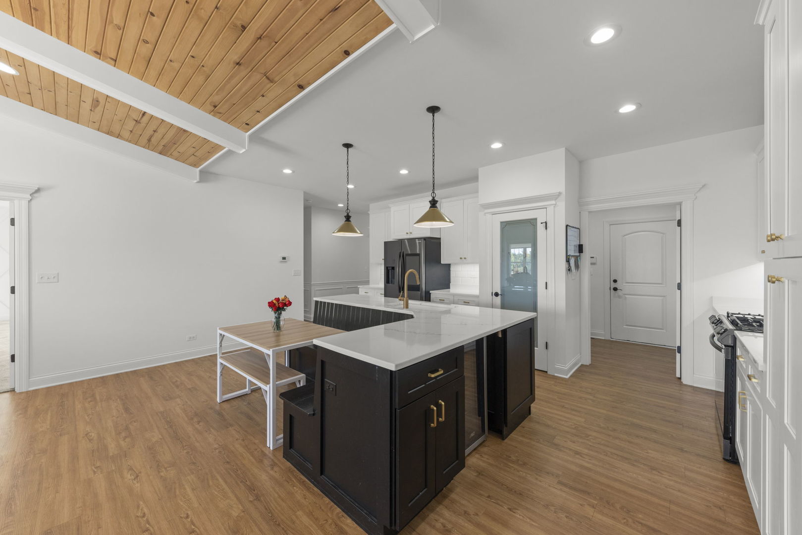 26411 West Stephanie Drive Channahon, IL 60410 - Photo 8 of 28 a kitchen with a sink and wooden floor