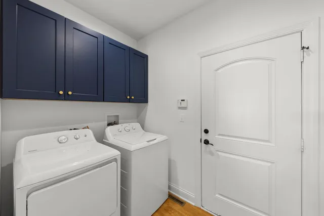a view of storage and utility room with washer and dryer