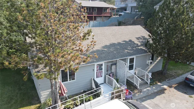 aerial view of a house with backyard porch and sitting area