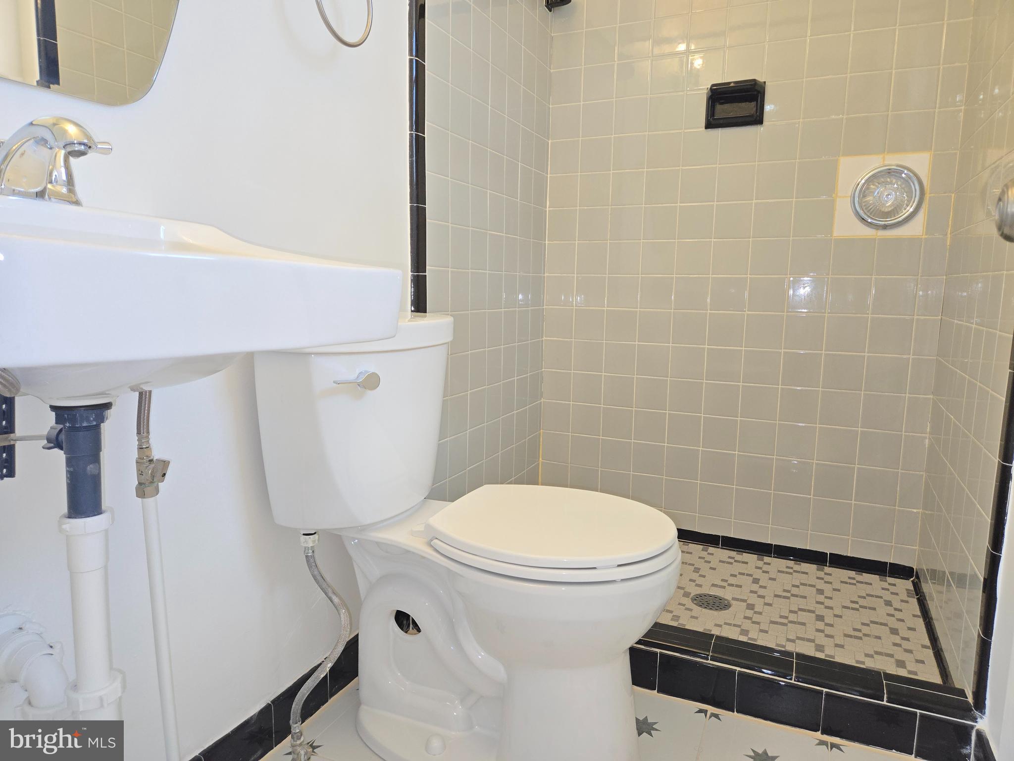 10500 Glenhaven Drive Silver Spring, MD 20902 - Photo 12 of 21 a bathroom with a toilet and a sink