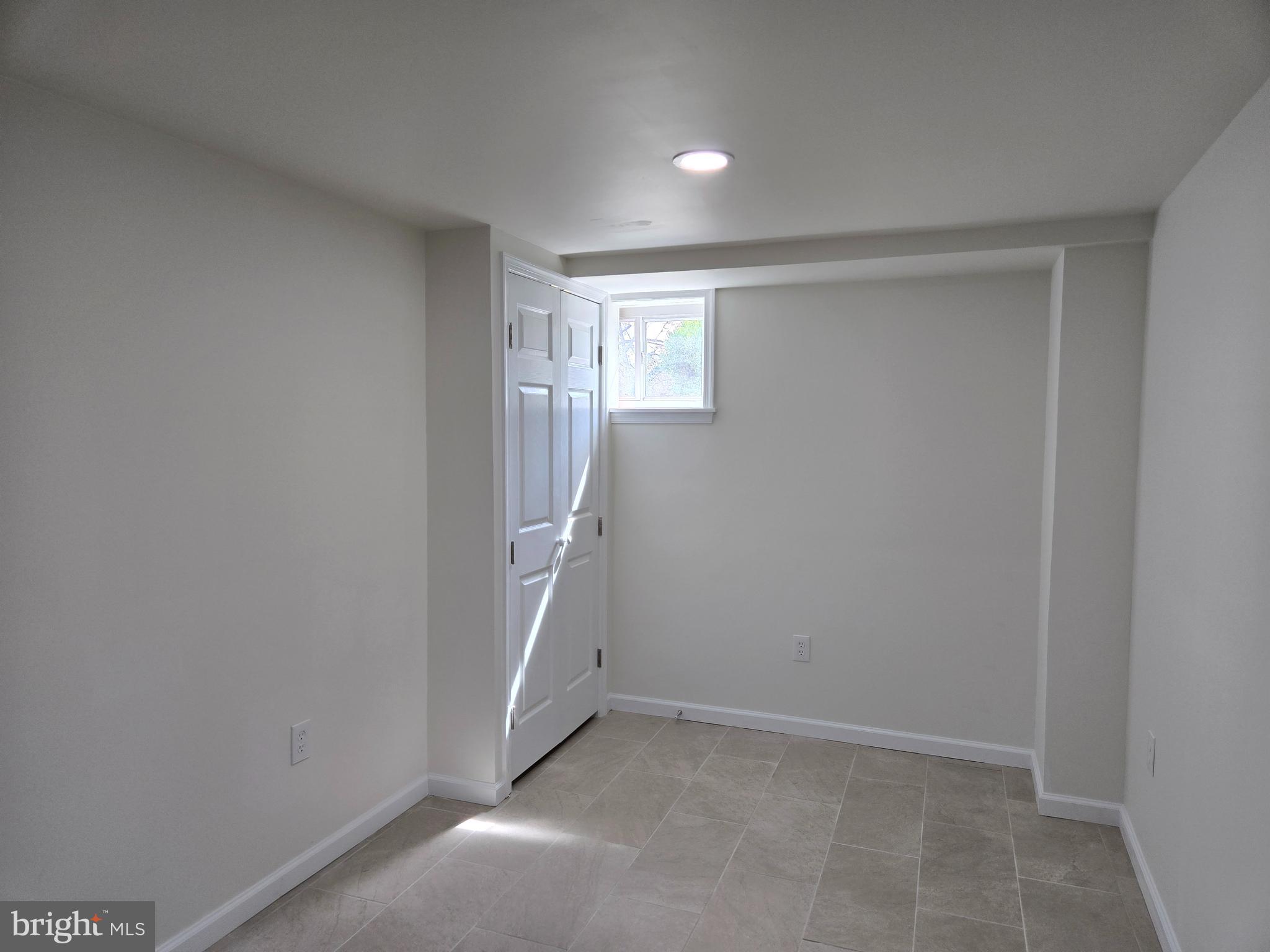 10500 Glenhaven Drive Silver Spring, MD 20902 - Photo 15 of 21 an empty room with windows