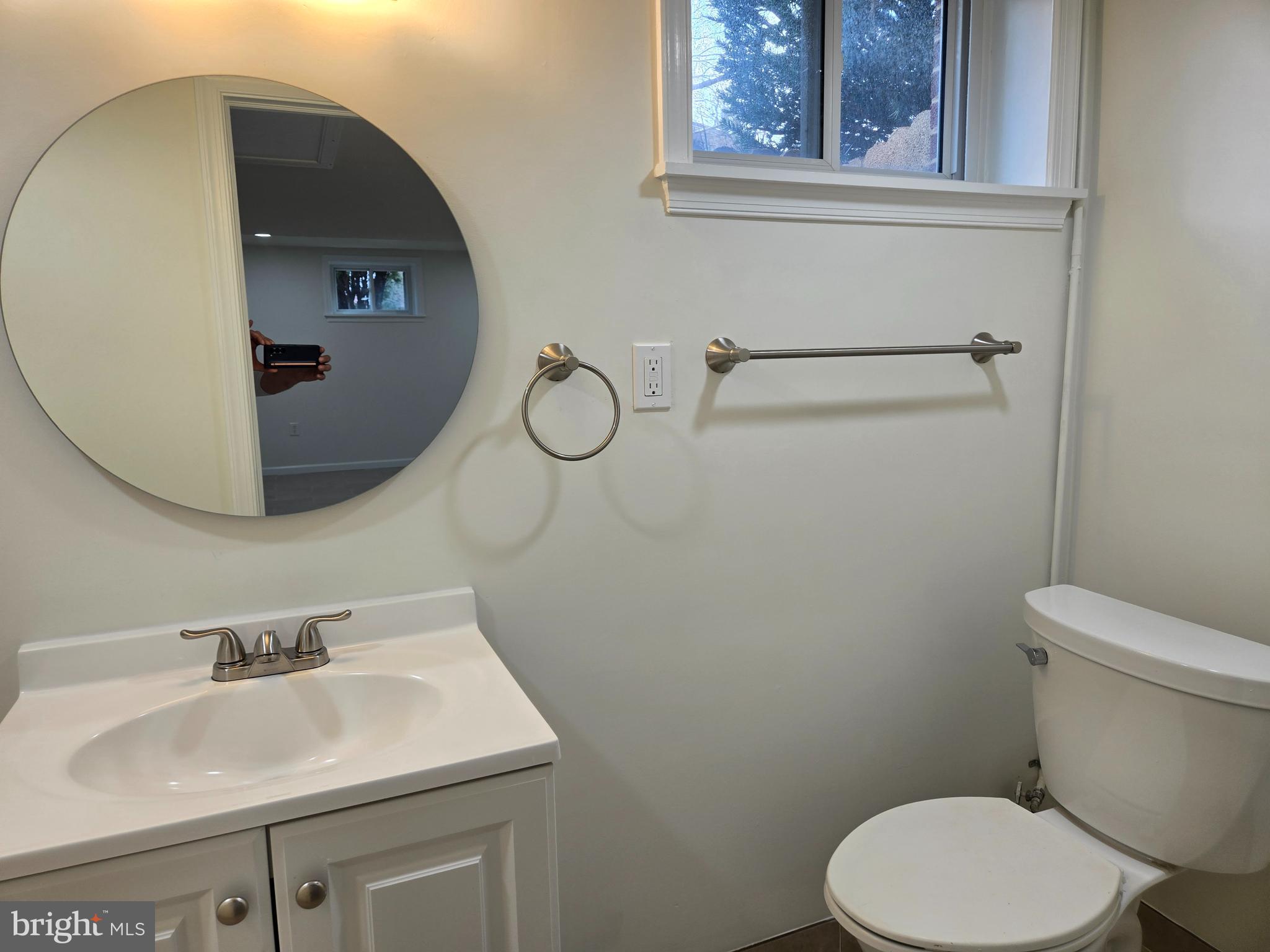10500 Glenhaven Drive Silver Spring, MD 20902 - Photo 16 of 21 a bathroom with a sink toilet and mirror