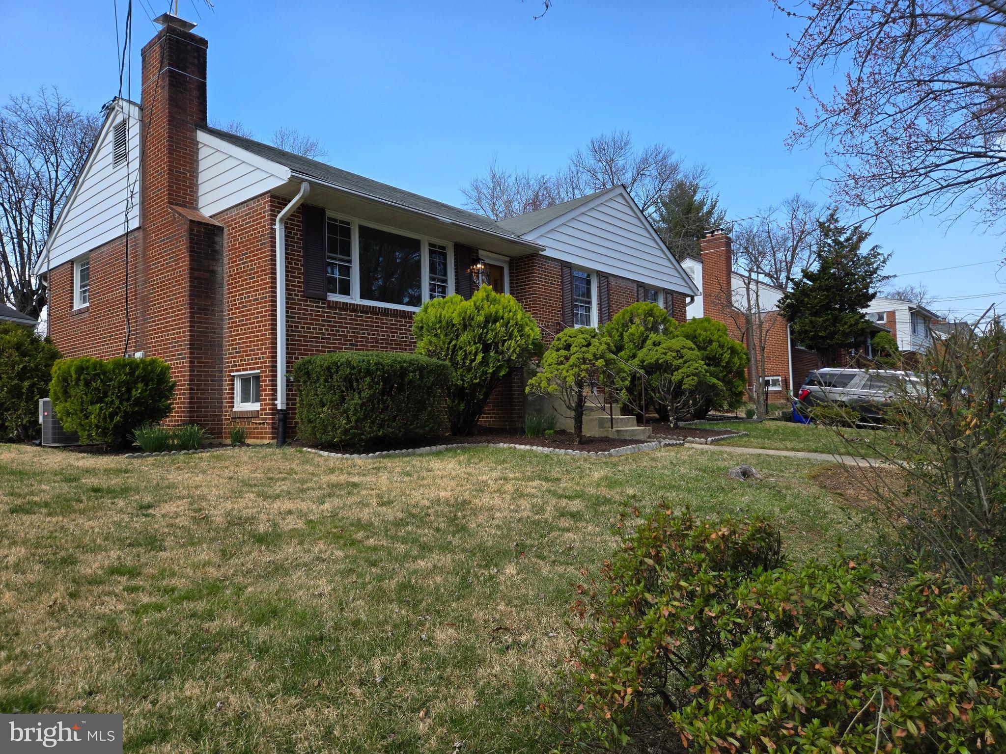 10500 Glenhaven Drive Silver Spring, MD 20902 - Photo 18 of 21 a front view of a house with garden