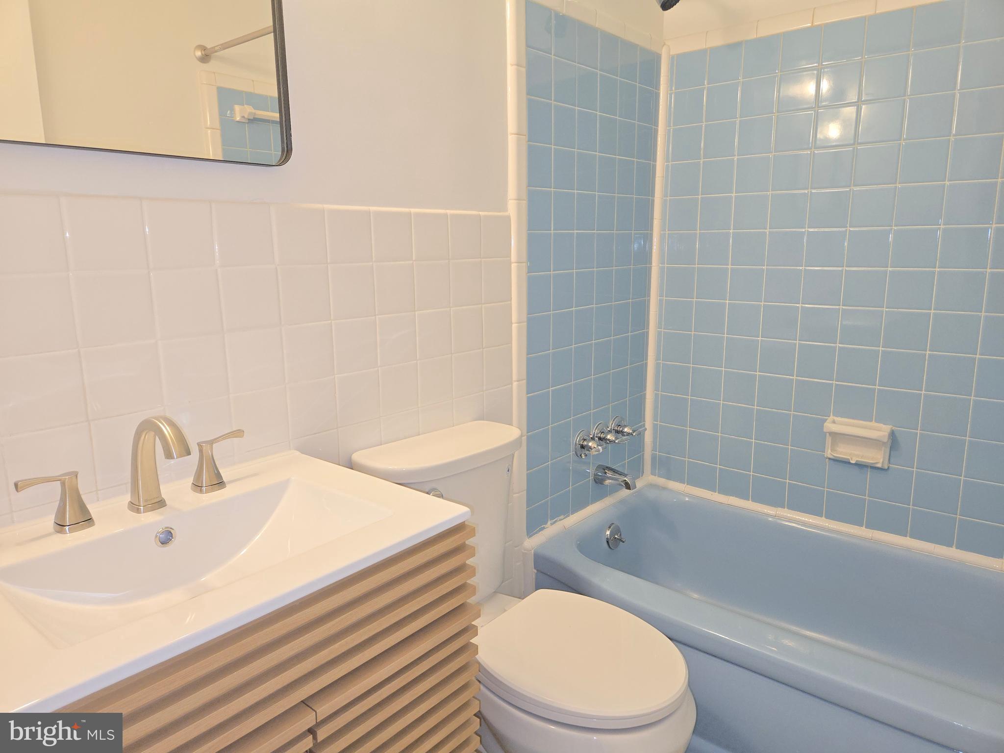 10500 Glenhaven Drive Silver Spring, MD 20902 - Photo 9 of 21 a bathroom with a sink a toilet and bathtub