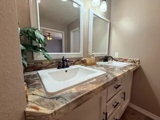 a bathroom with a sink and a mirror