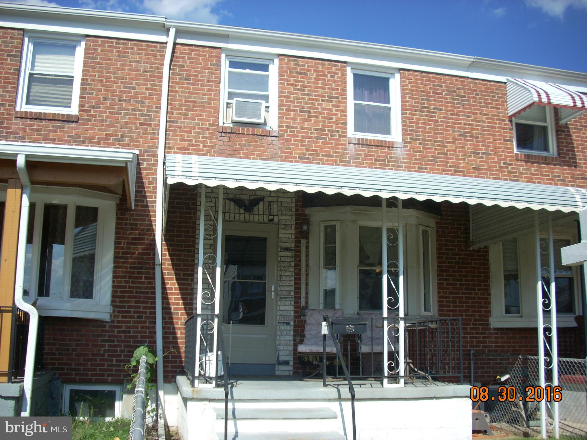 8374 Kavanagh Road Baltimore, MD 21222 - Photo 2 of 24 a view of a brick building with large windows