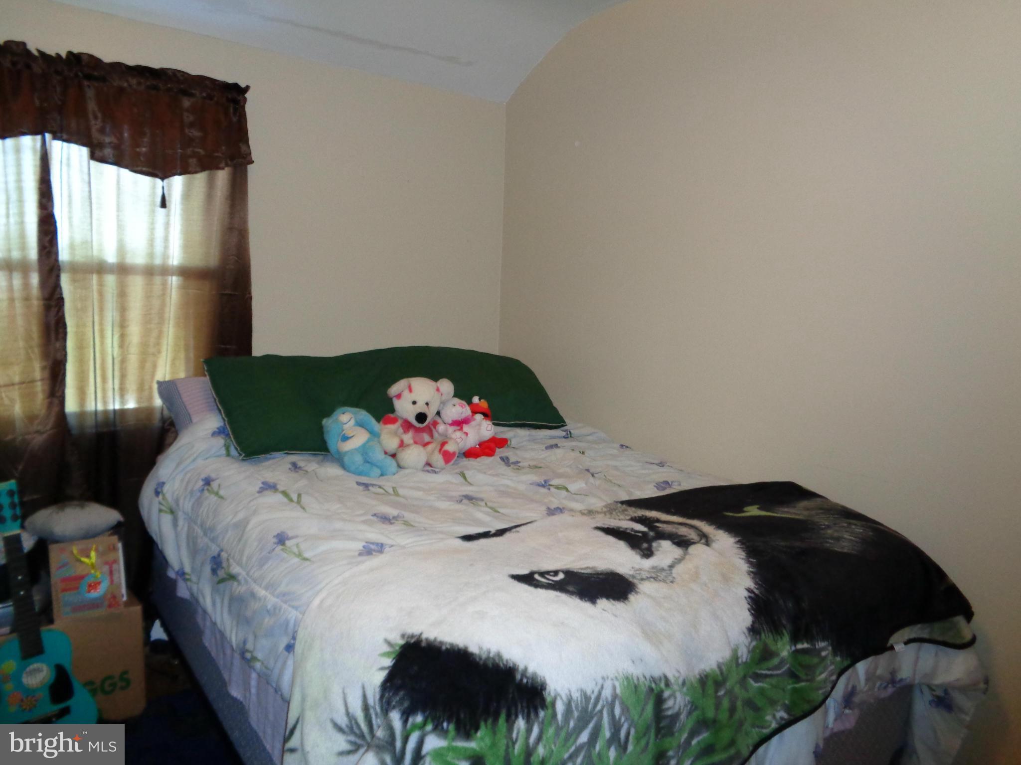 8374 Kavanagh Road Baltimore, MD 21222 - Photo 12 of 24 a bedroom with a bed and a window