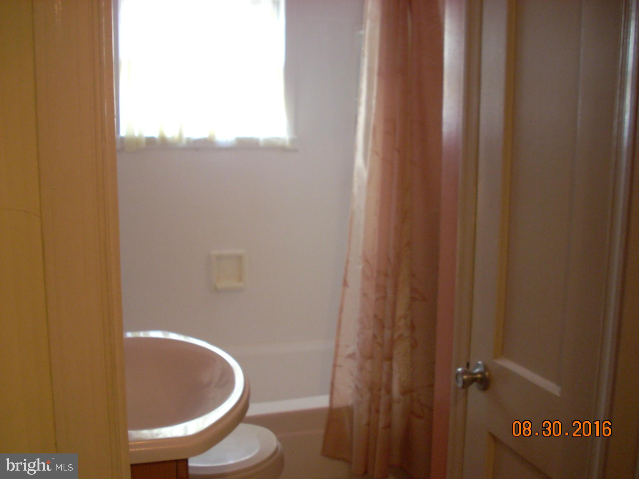 8374 Kavanagh Road Baltimore, MD 21222 - Photo 15 of 24 a bathroom with a toilet and a sink