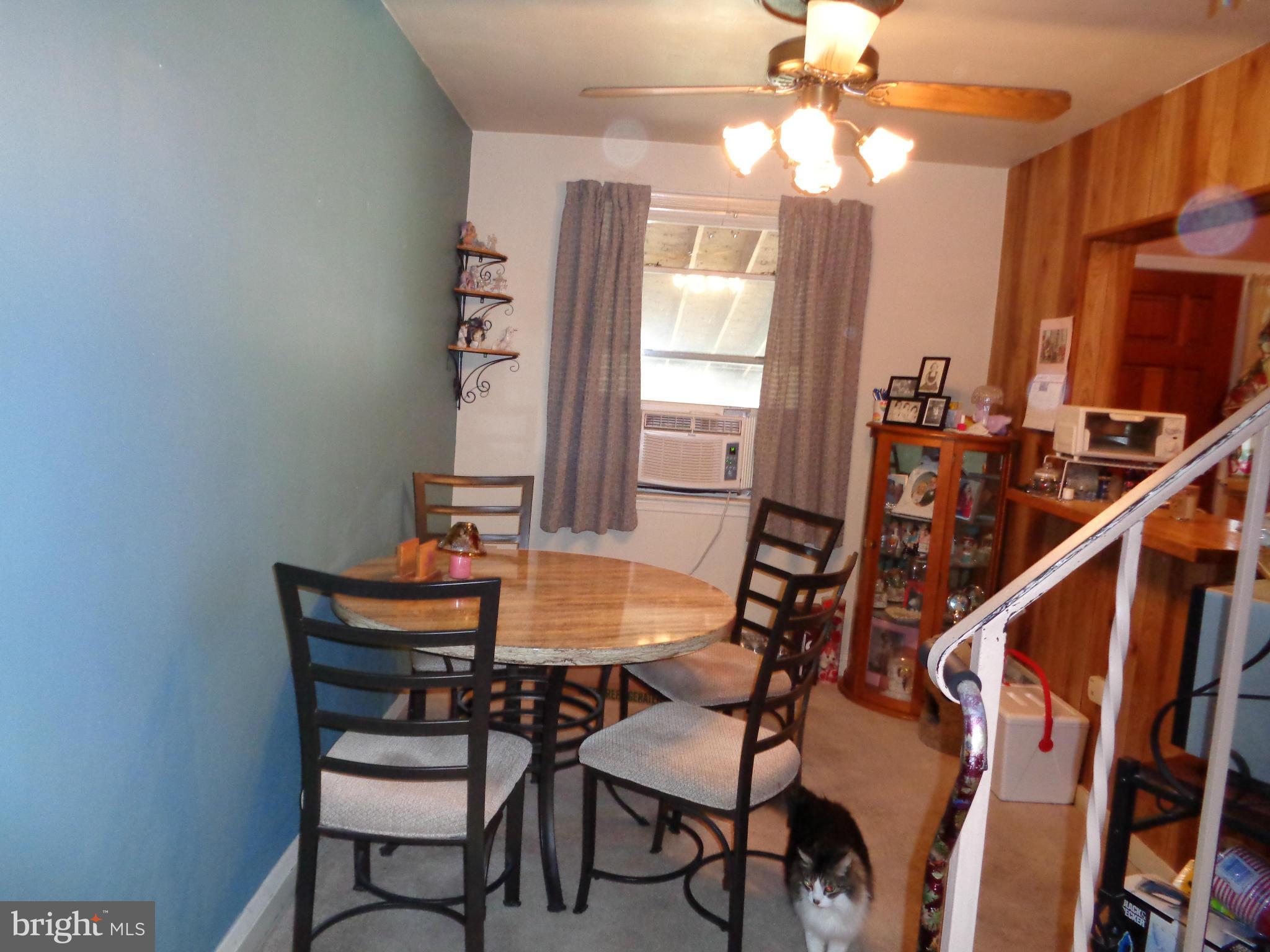 8374 Kavanagh Road Baltimore, MD 21222 - Photo 5 of 24 a dining room with furniture and window