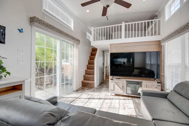 a kitchen with cabinets a window and appliances