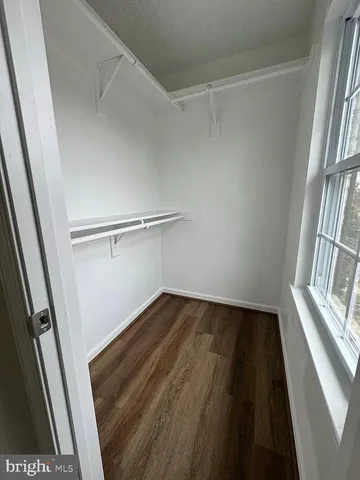 a view of a room with wooden floor and staircase