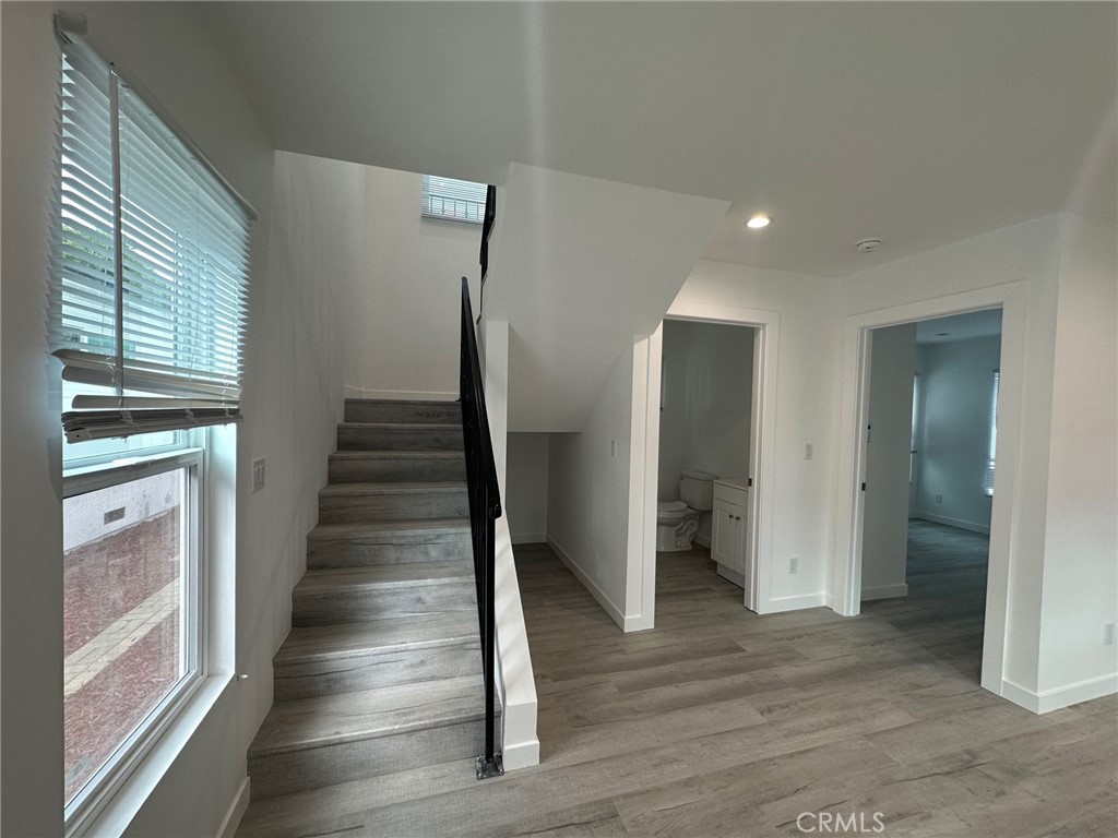 7012 Bertrand Avenue Reseda, CA 91335 - Photo 11 of 23 a view of an entryway with wooden floor and staircase