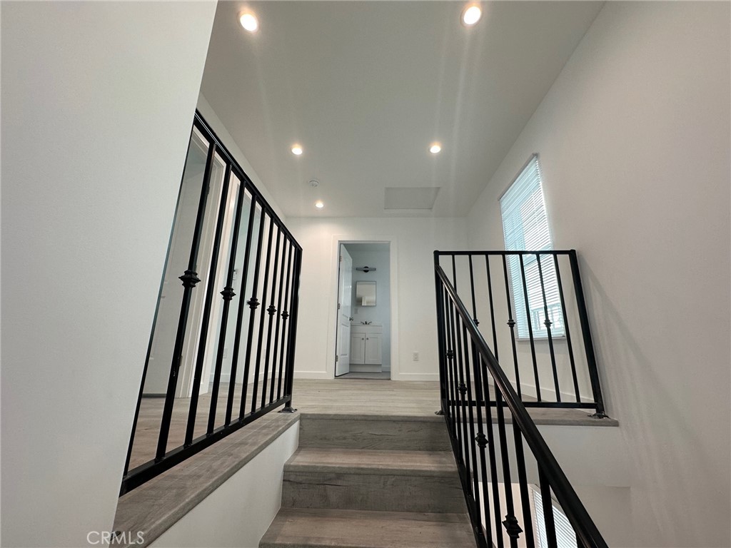 7012 Bertrand Avenue Reseda, CA 91335 - Photo 12 of 23 wooden floor in a hall with wooden floor and a bathroom