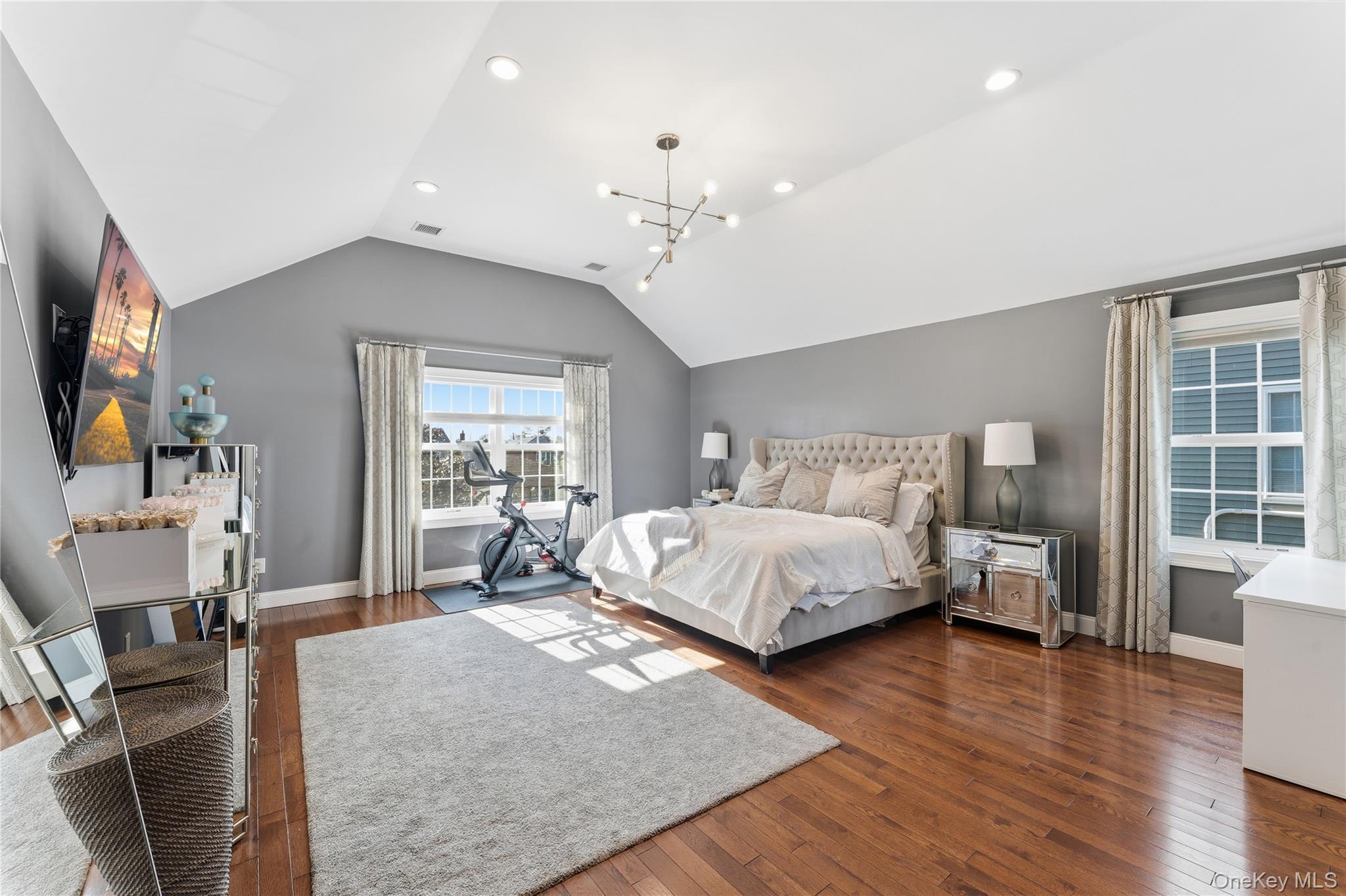 3483 Frederick Street Oceanside, NY 11572 - Photo 17 of 34 a bedroom with a large bed and wooden floor
