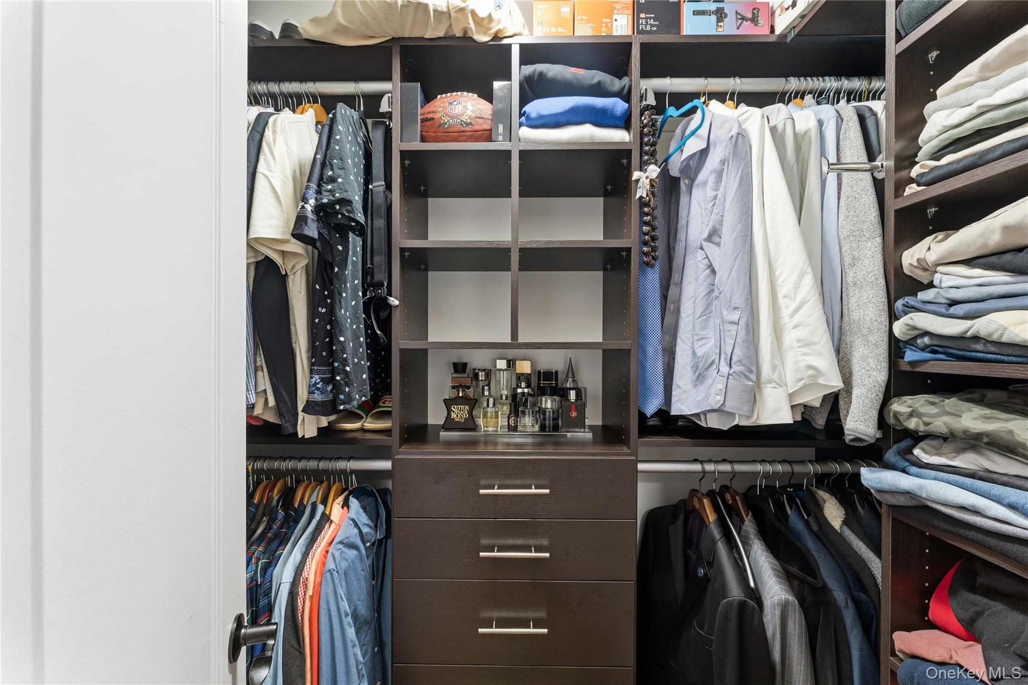 3483 Frederick Street Oceanside, NY 11572 - Photo 29 of 34 a view of walk in closet with clothes and shoes