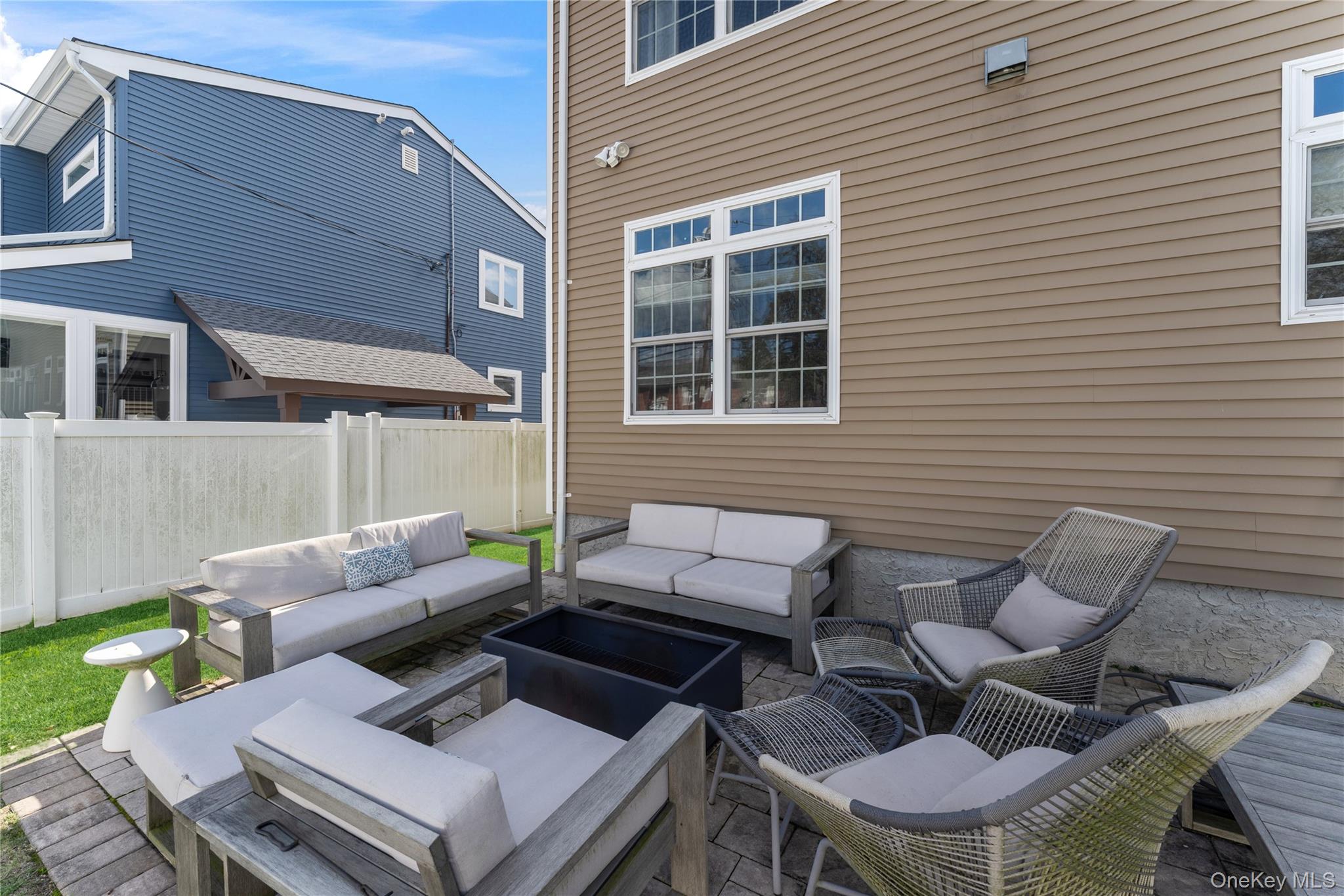 3483 Frederick Street Oceanside, NY 11572 - Photo 31 of 34 a view of a patio with couple of chairs and a couch