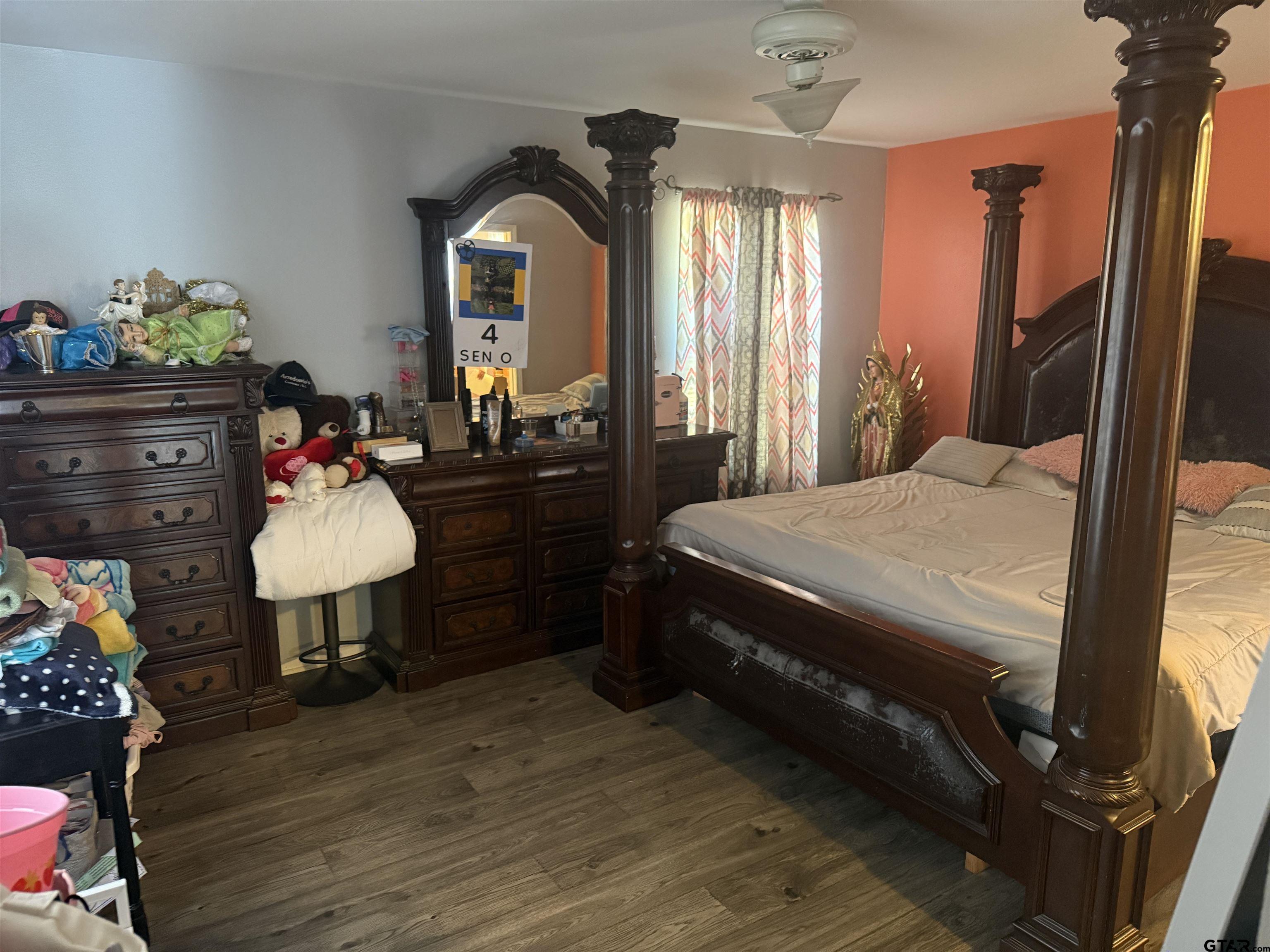 111 Jerome Court Rusk, TX 75785 - Photo 14 of 16 a bedroom with a bed and wooden floor