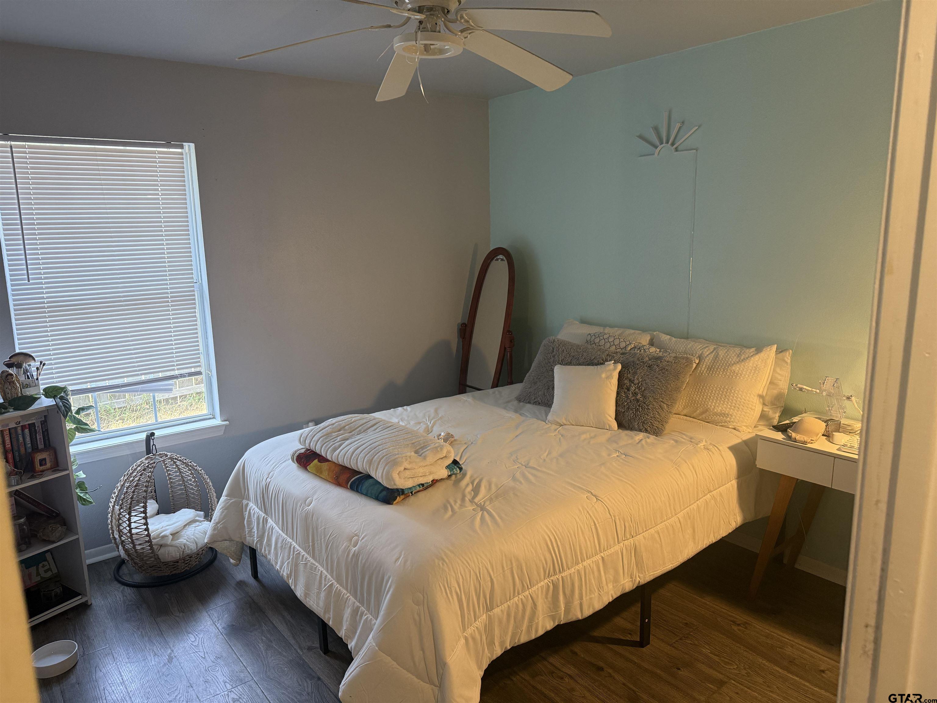 111 Jerome Court Rusk, TX 75785 - Photo 15 of 16 a bedroom with a bed and wooden floor