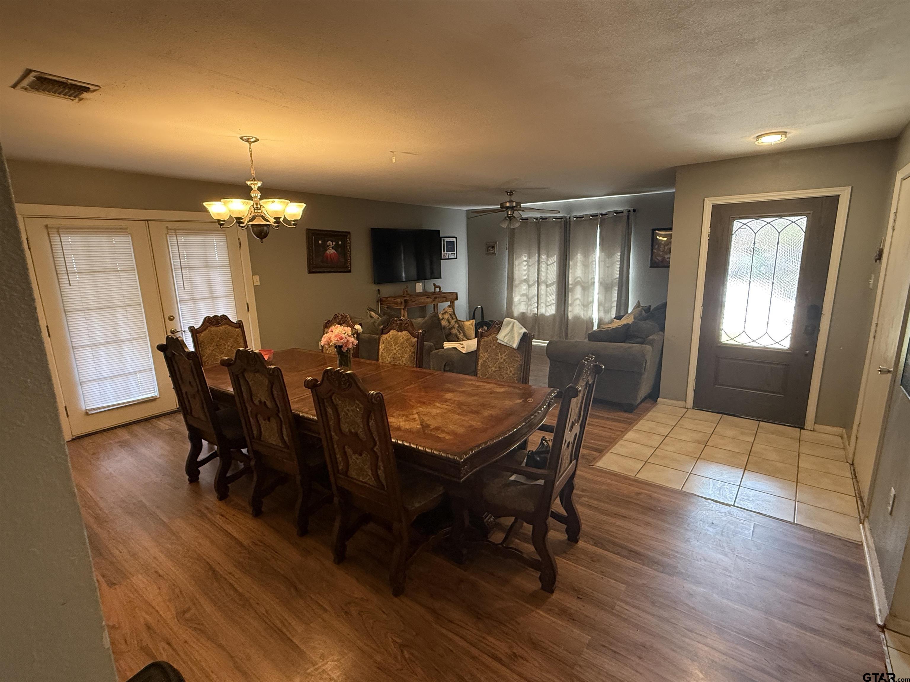111 Jerome Court Rusk, TX 75785 - Photo 8 of 16 a view of a dining room with furniture and chandelier