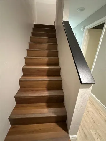 a kitchen with a appliances a sink and cabinets