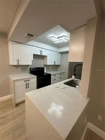 a view of a room with a flat screen tv