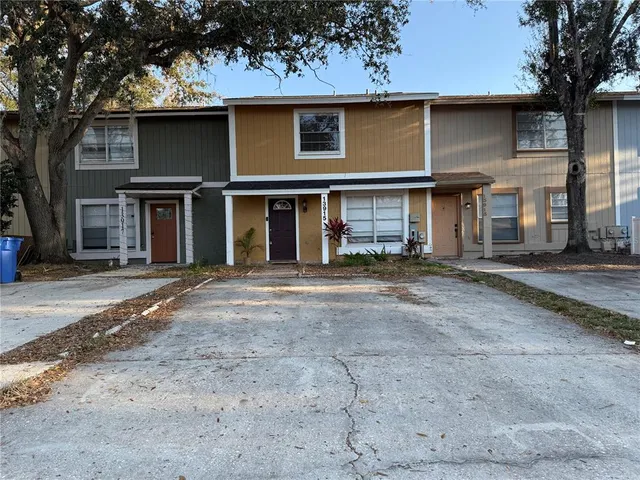 a view of a house with a tree