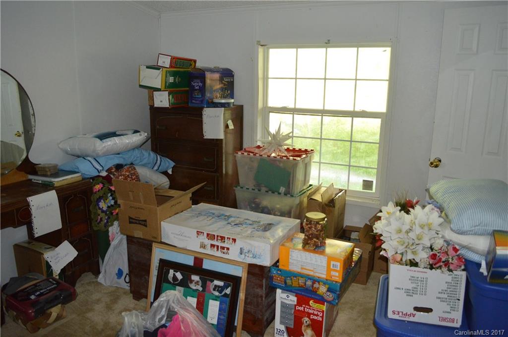 793 Old Clyde Road Clyde, NC 28721 - Photo 22 of 23 a room with furniture and a window