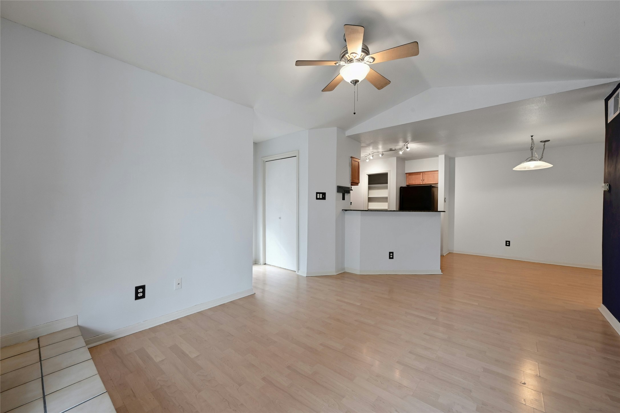2450 Wickersham Lane, Unit 710 Austin, TX 78741 - Photo 7 of 20 a view of a kitchen with microwave and a stove