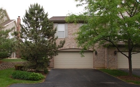 2103 Ivy Ridge Drive Hoffman Estates, IL 60192 - Photo 1 of 24 a view of a yard in front of a house with a large tree