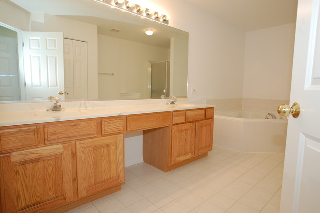2103 Ivy Ridge Drive Hoffman Estates, IL 60192 - Photo 12 of 24 a bathroom with a sink double vanity and a mirror