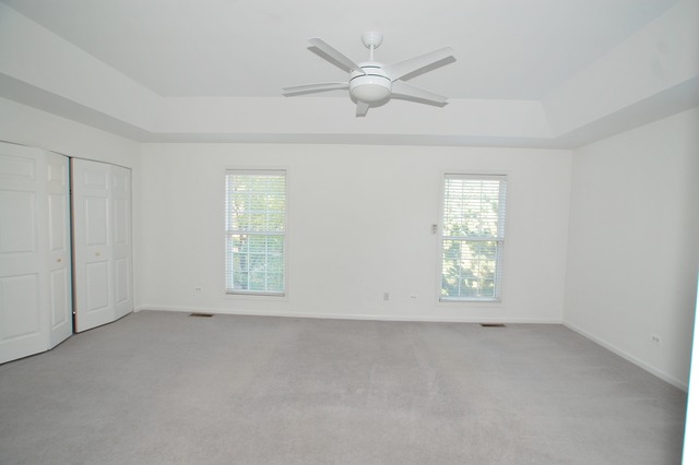 2103 Ivy Ridge Drive Hoffman Estates, IL 60192 - Photo 13 of 24 an empty room with windows and fan
