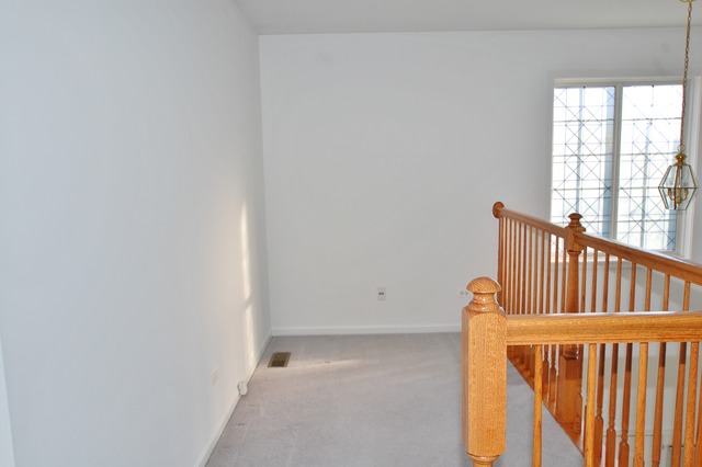 2103 Ivy Ridge Drive Hoffman Estates, IL 60192 - Photo 15 of 24 a view of a door and wooden floor