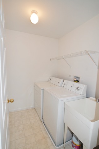 2103 Ivy Ridge Drive Hoffman Estates, IL 60192 - Photo 17 of 24 a utility room with dryer and washer