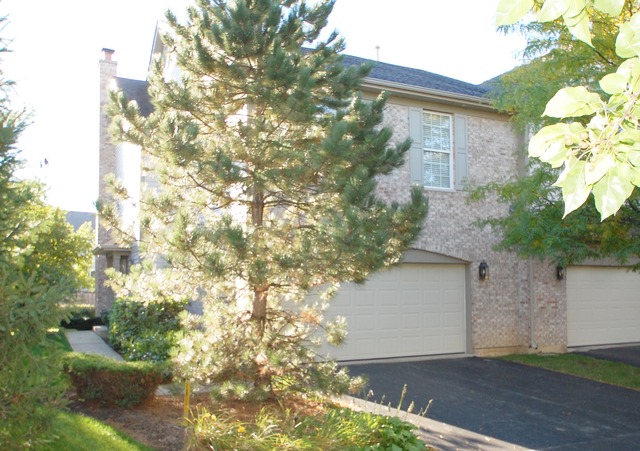 2103 Ivy Ridge Drive Hoffman Estates, IL 60192 - Photo 2 of 24 a front view of a house with a yard and garage
