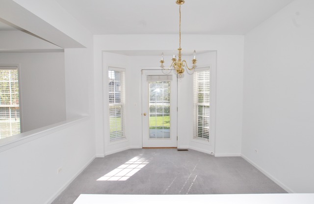 2103 Ivy Ridge Drive Hoffman Estates, IL 60192 - Photo 6 of 24 a view of an empty room with a window