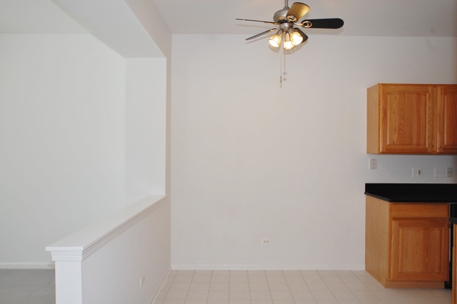 2103 Ivy Ridge Drive Hoffman Estates, IL 60192 - Photo 9 of 24 a lamp on a small space with a chandelier fan