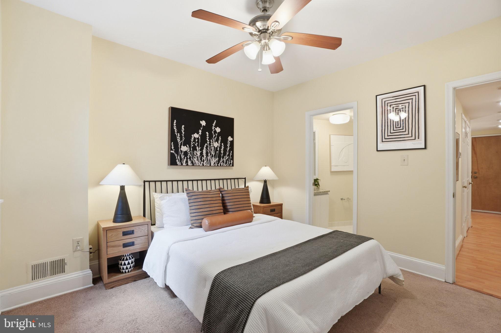 1835 16th Street Northwest, Unit 1 Washington, DC 20009 - Photo 14 of 27 a bedroom with a large bed and a chandelier