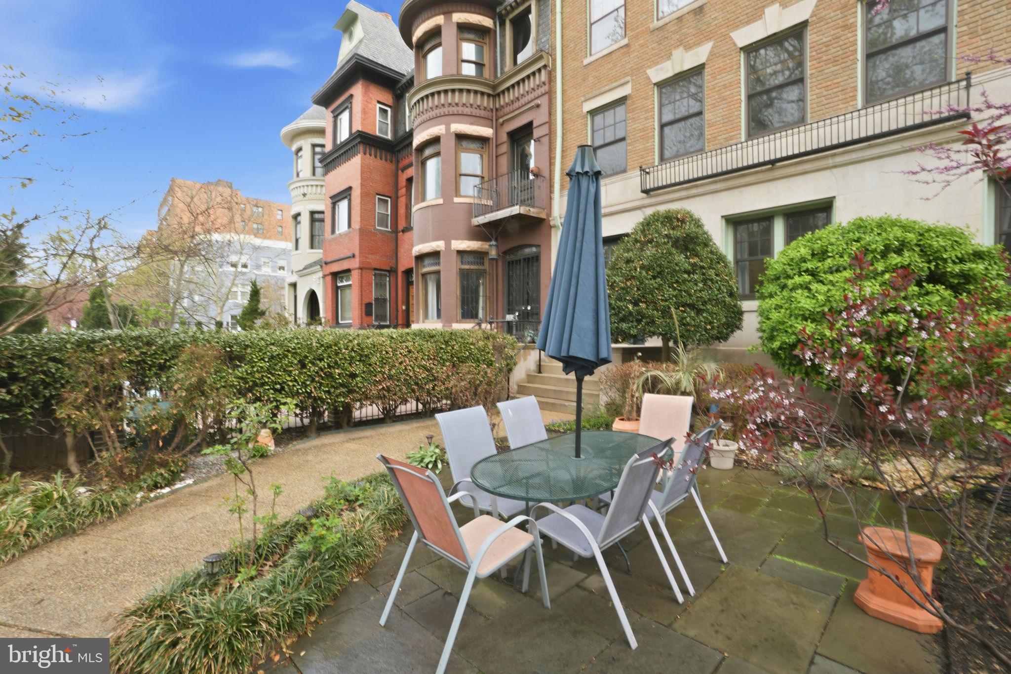 1835 16th Street Northwest, Unit 1 Washington, DC 20009 - Photo 22 of 27 a patio with table and chairs and potted plants