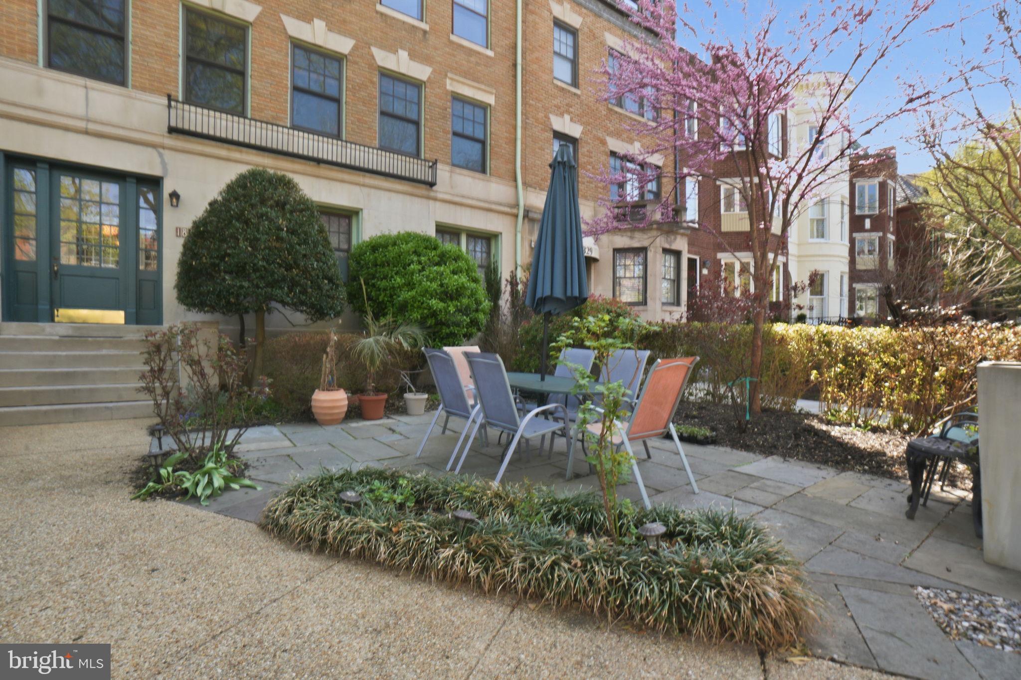 1835 16th Street Northwest, Unit 1 Washington, DC 20009 - Photo 23 of 27 a wooden bench sitting in front of a building