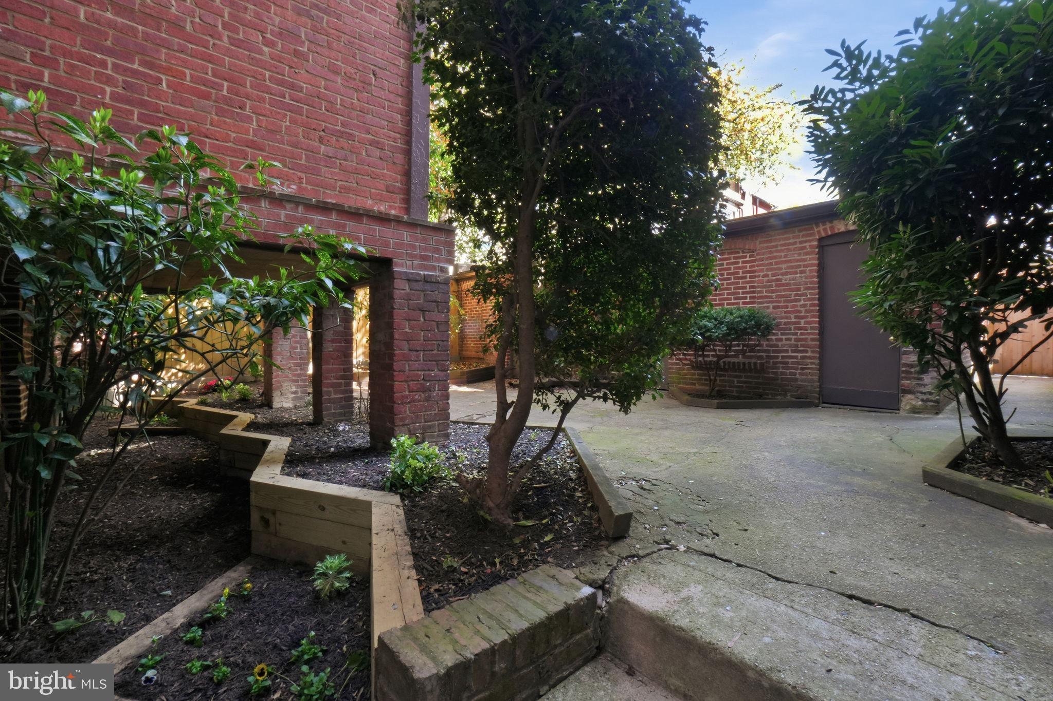 1835 16th Street Northwest, Unit 1 Washington, DC 20009 - Photo 25 of 27 a view of a house with a yard and tree s