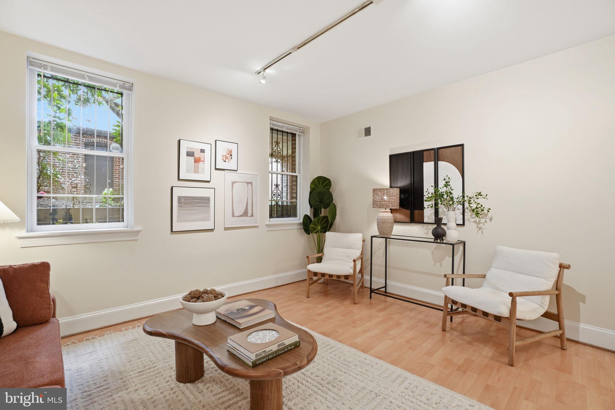 1835 16th Street Northwest, Unit 1 Washington, DC 20009 - Photo 5 of 27 a living room with furniture and a window