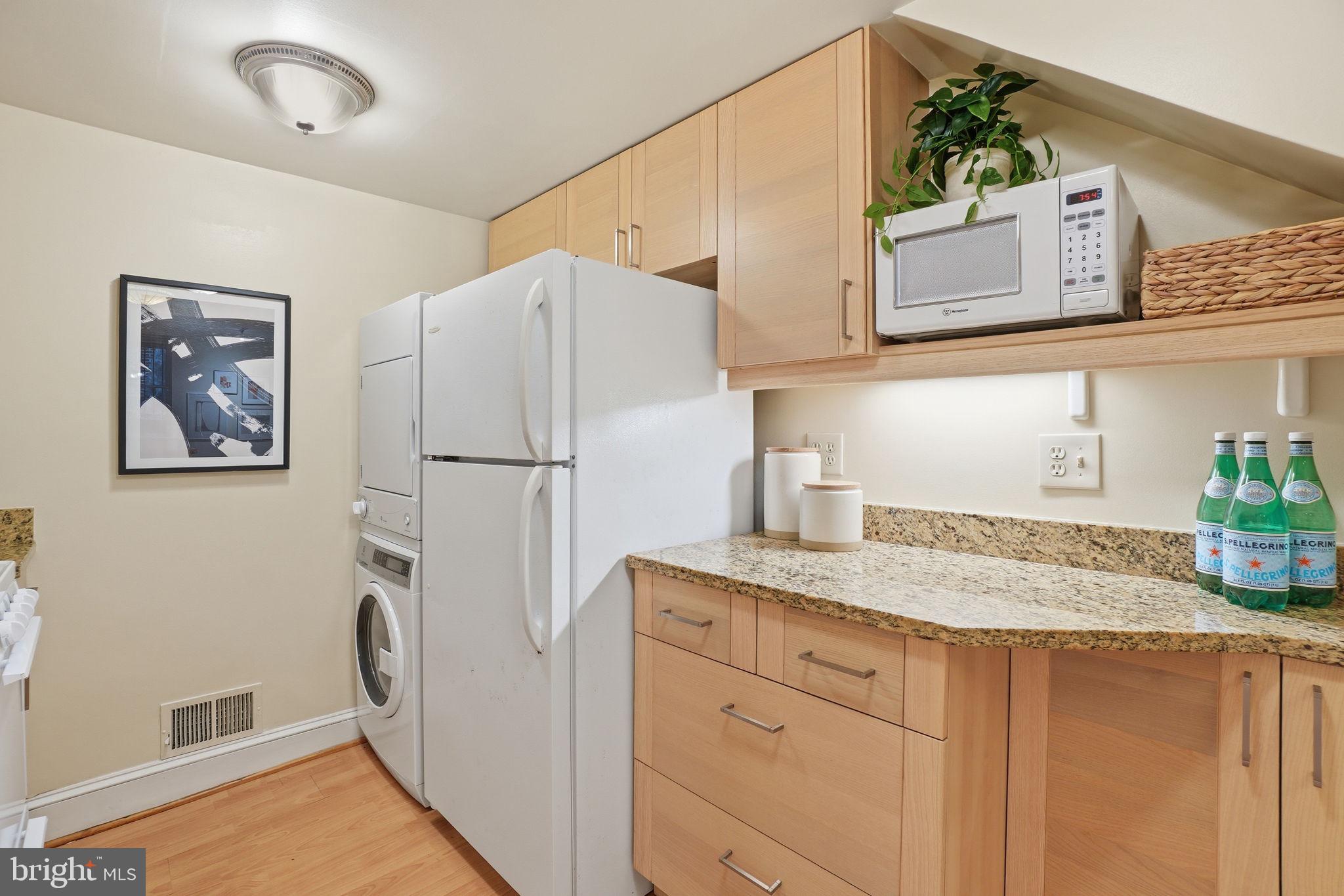 1835 16th Street Northwest, Unit 1 Washington, DC 20009 - Photo 9 of 27 a kitchen with stainless steel appliances granite countertop a refrigerator and a sink